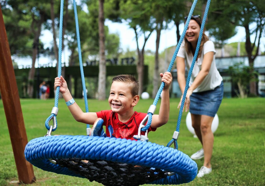 a kid using a swing