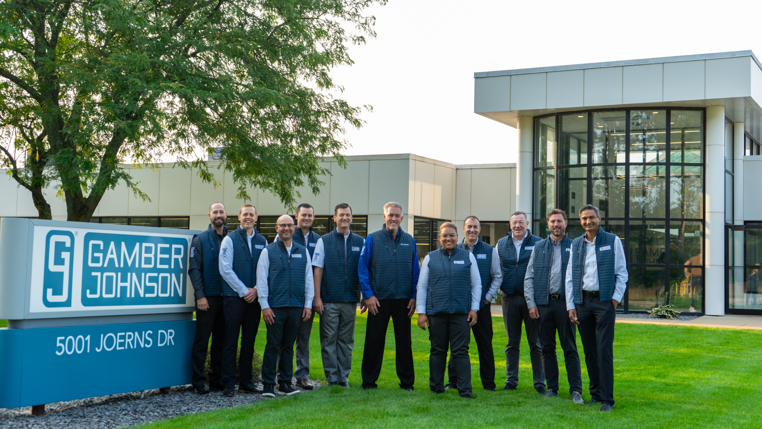 Executive Team for Team Gamber-Johnson standing outside GJ HQ